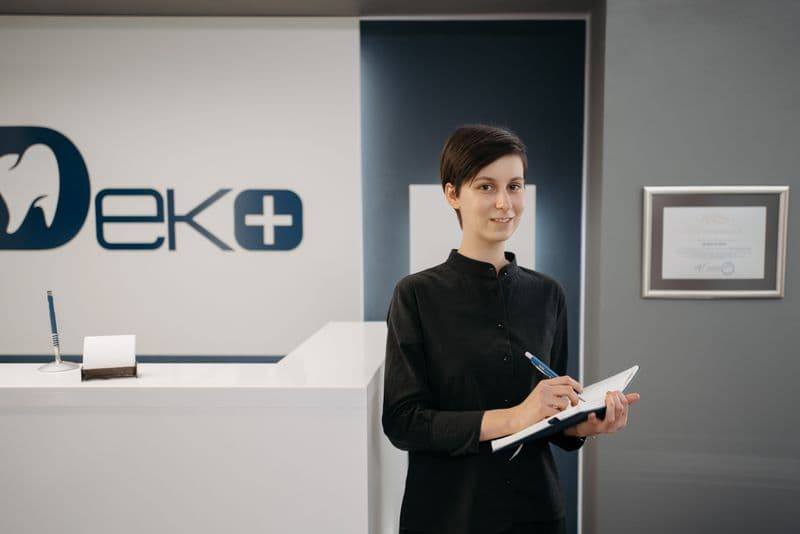 Receptionist at a front desk